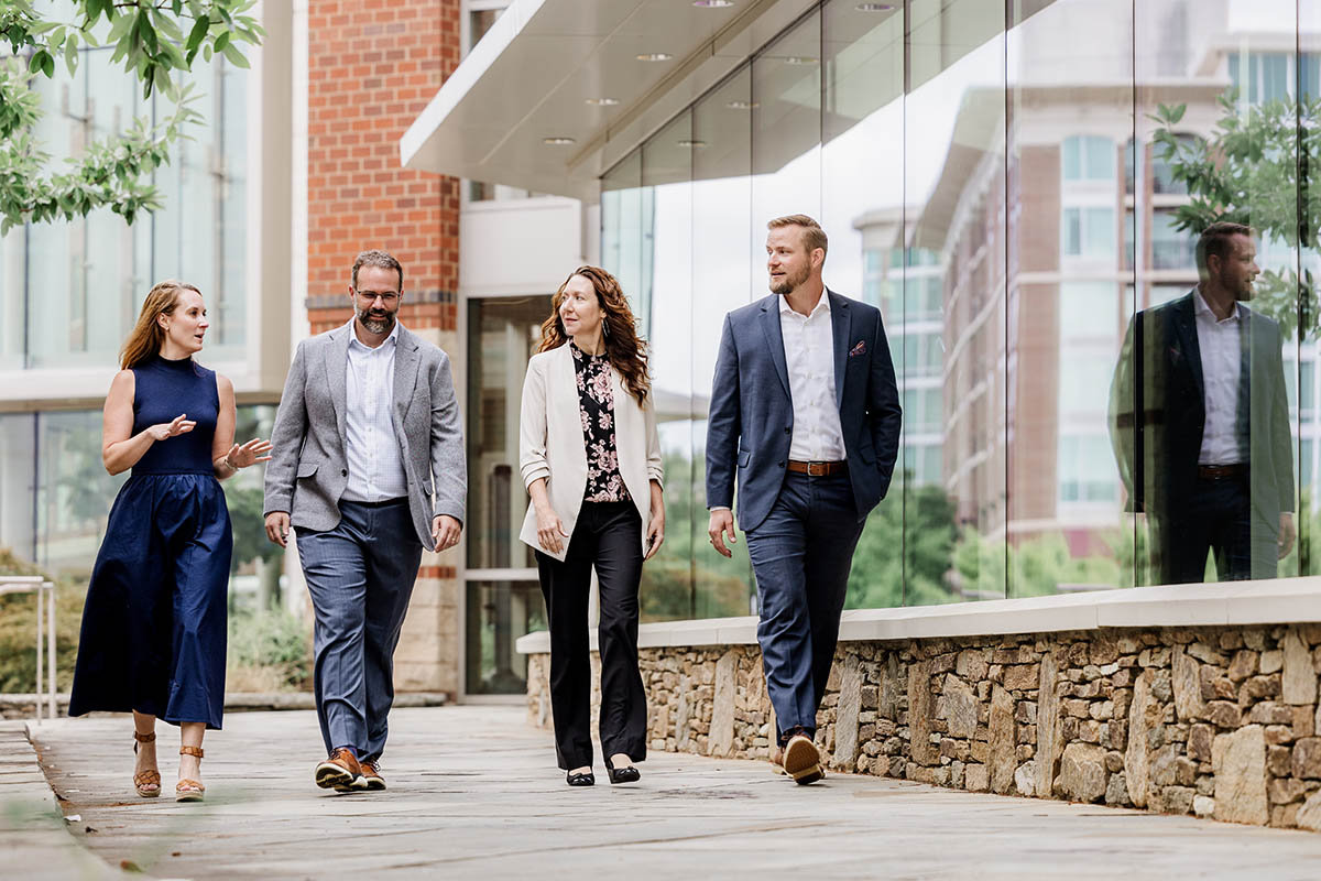 Provista Wealth team talking while walking down sidewalk